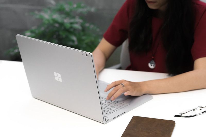 A lady using Microsoft Surface laptop 