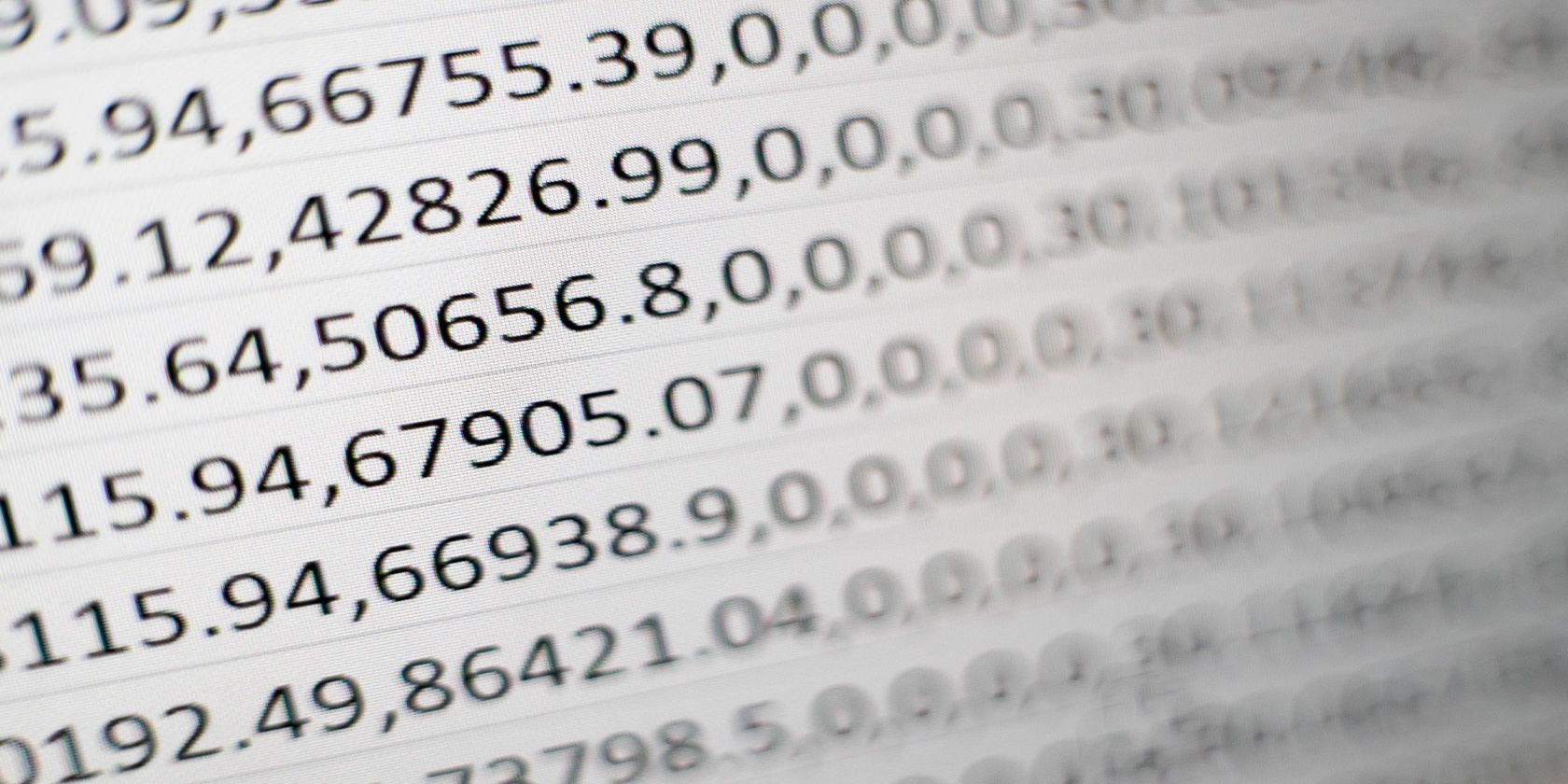 A photo shows Microsoft Excel cells with numbers and decimal points. 