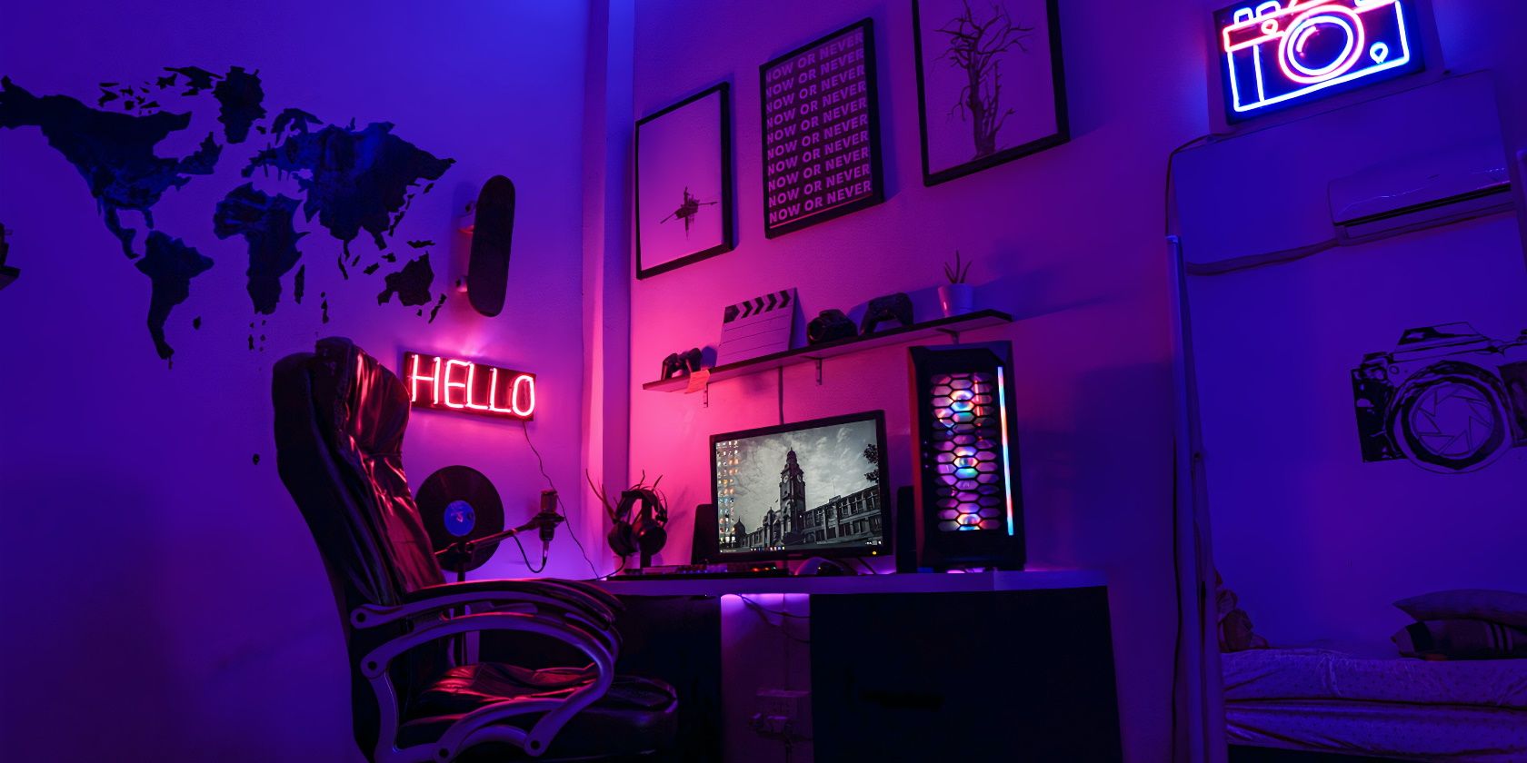 Computer and chair in a room covered in blue and purple light