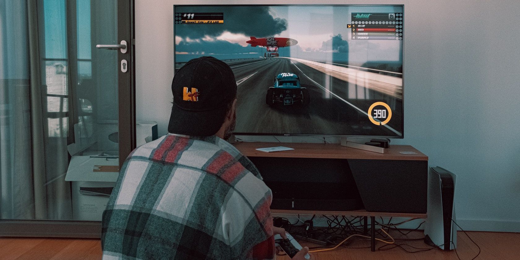 A person playing a racing game on a PS5
