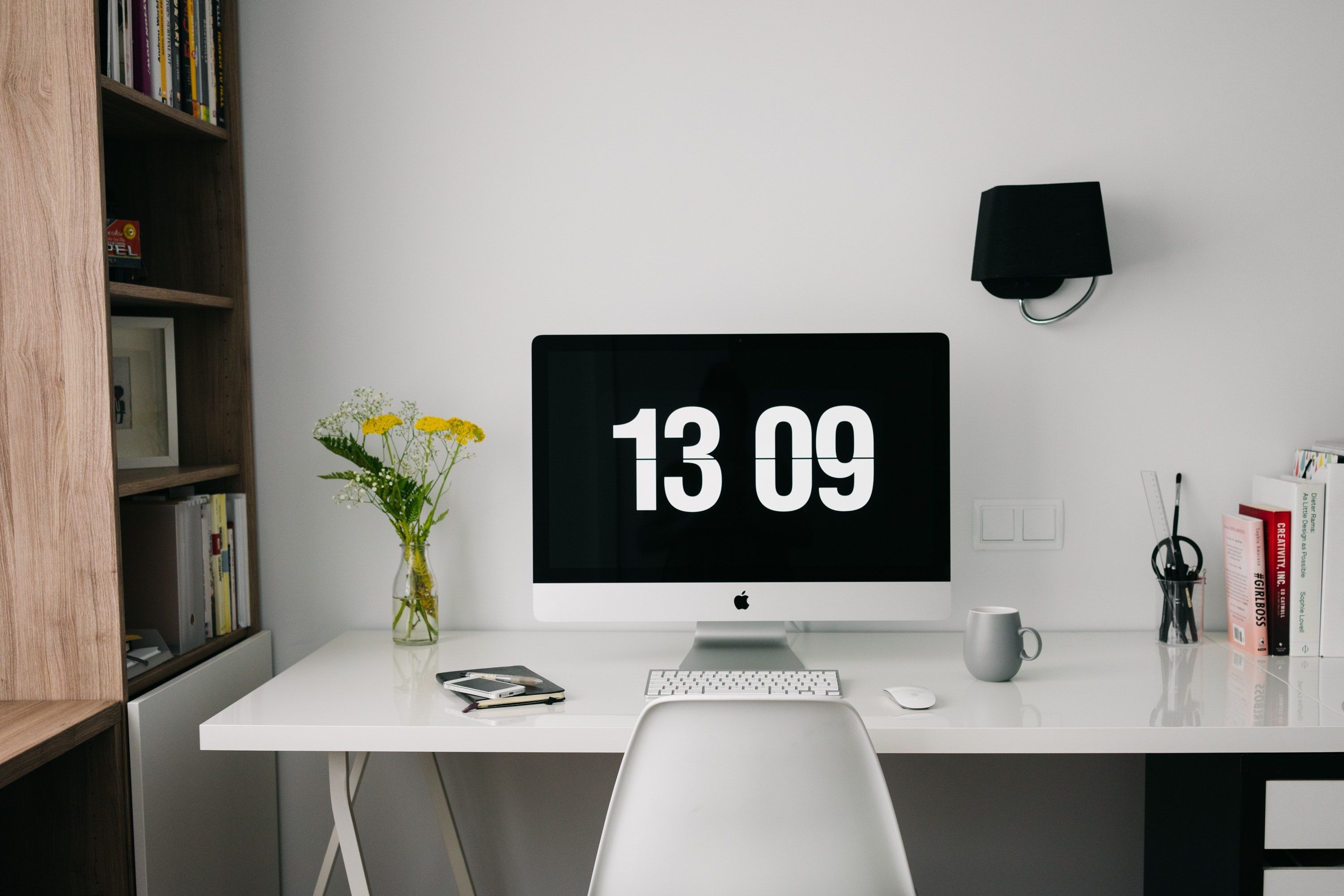Mac desktop computer displaying a large clock. 