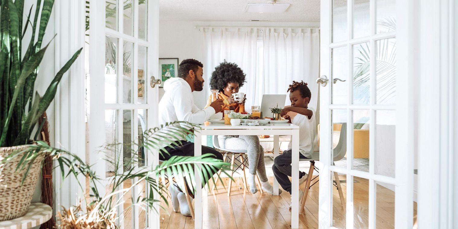 photo showing family of three in their home dining
