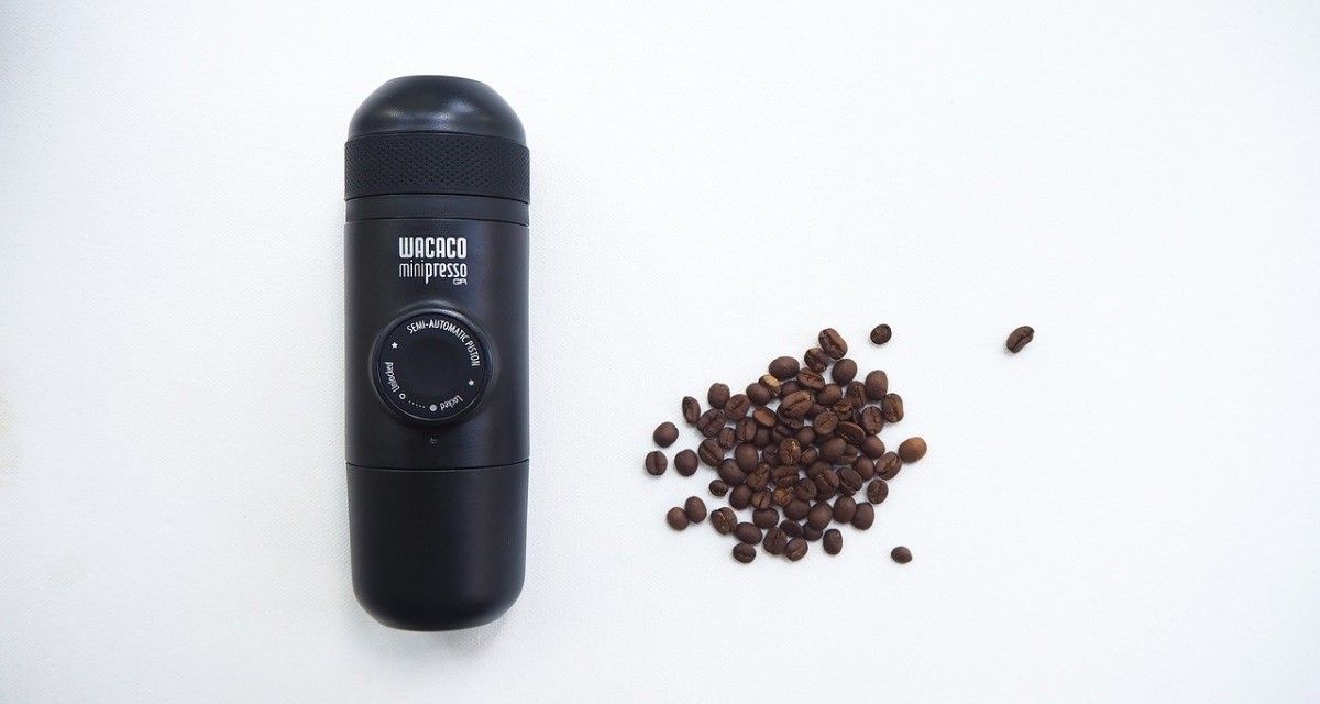 wacaco minipresso beside coffee beans