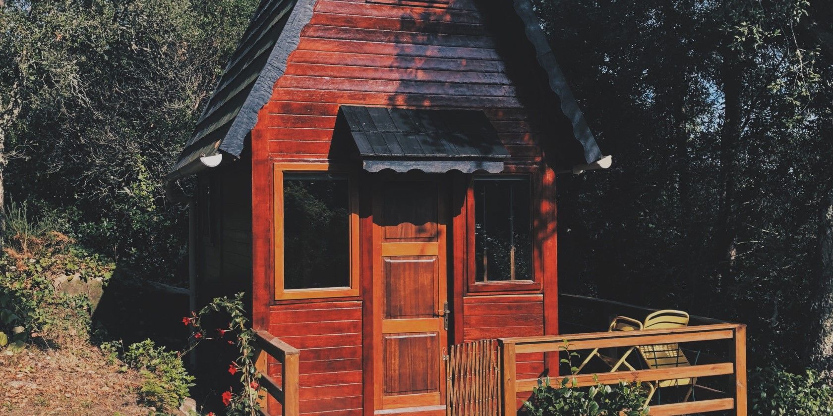 red tiny house with porch