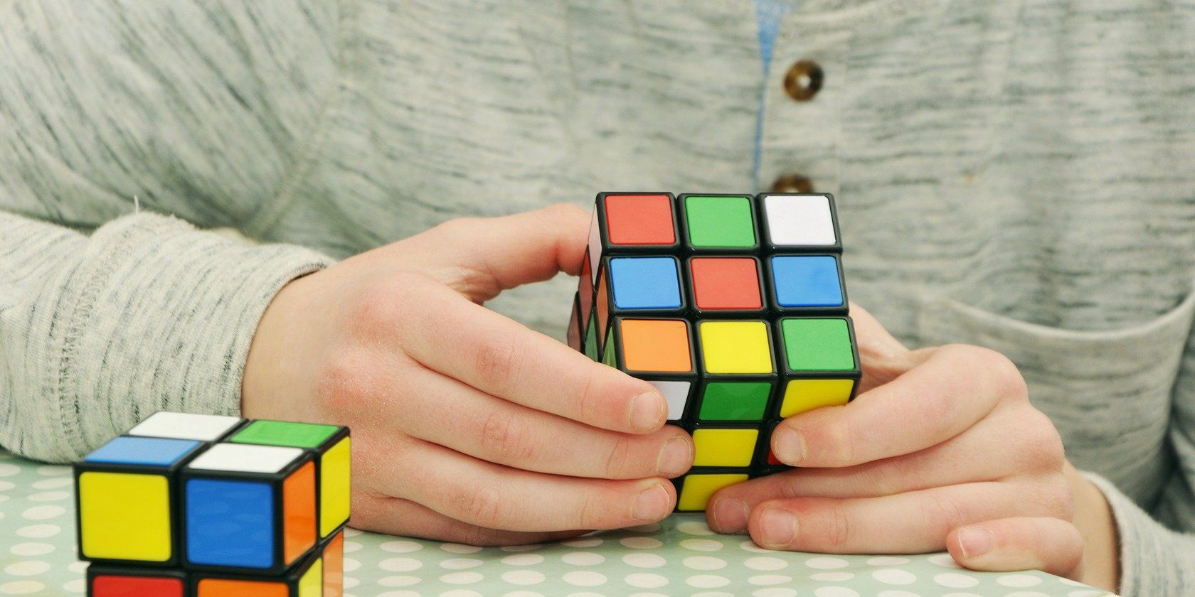 Person solving a rubiks cube