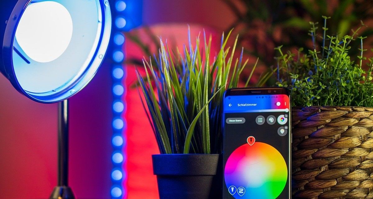 smartphone controlling colors of smart light bulb