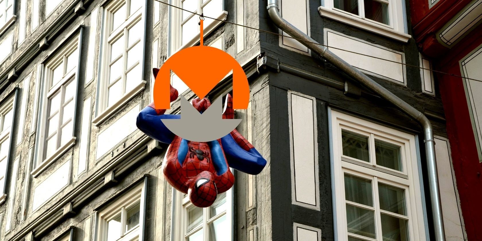 Monero coin juxtaposed against an image of Spider-Man hanging upside down