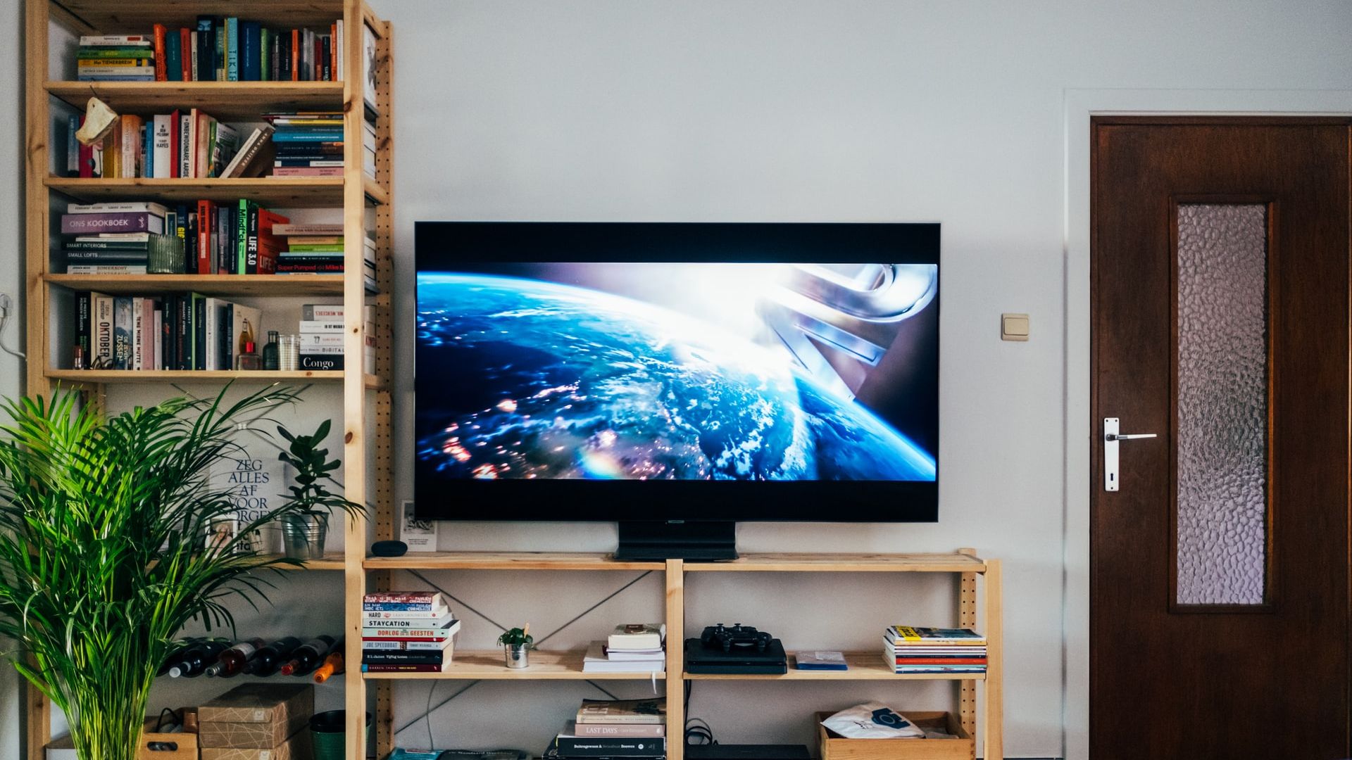 hdtv 4k television tv in living room with dark image of outer space