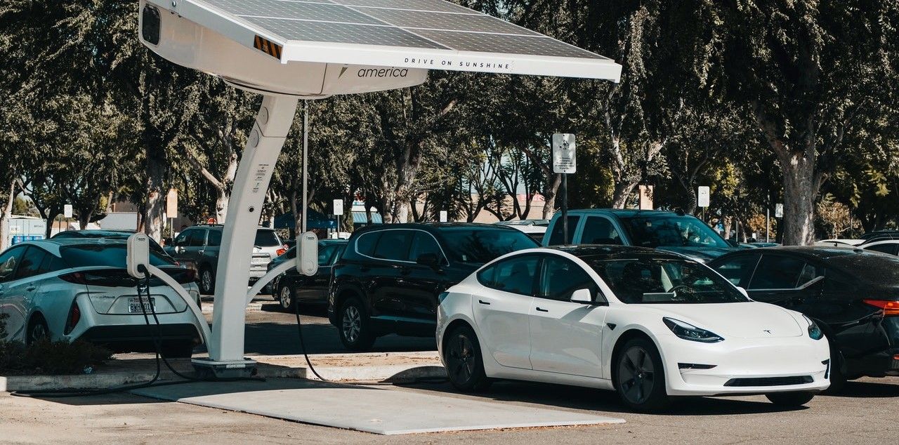 tesla car in a solar charging station