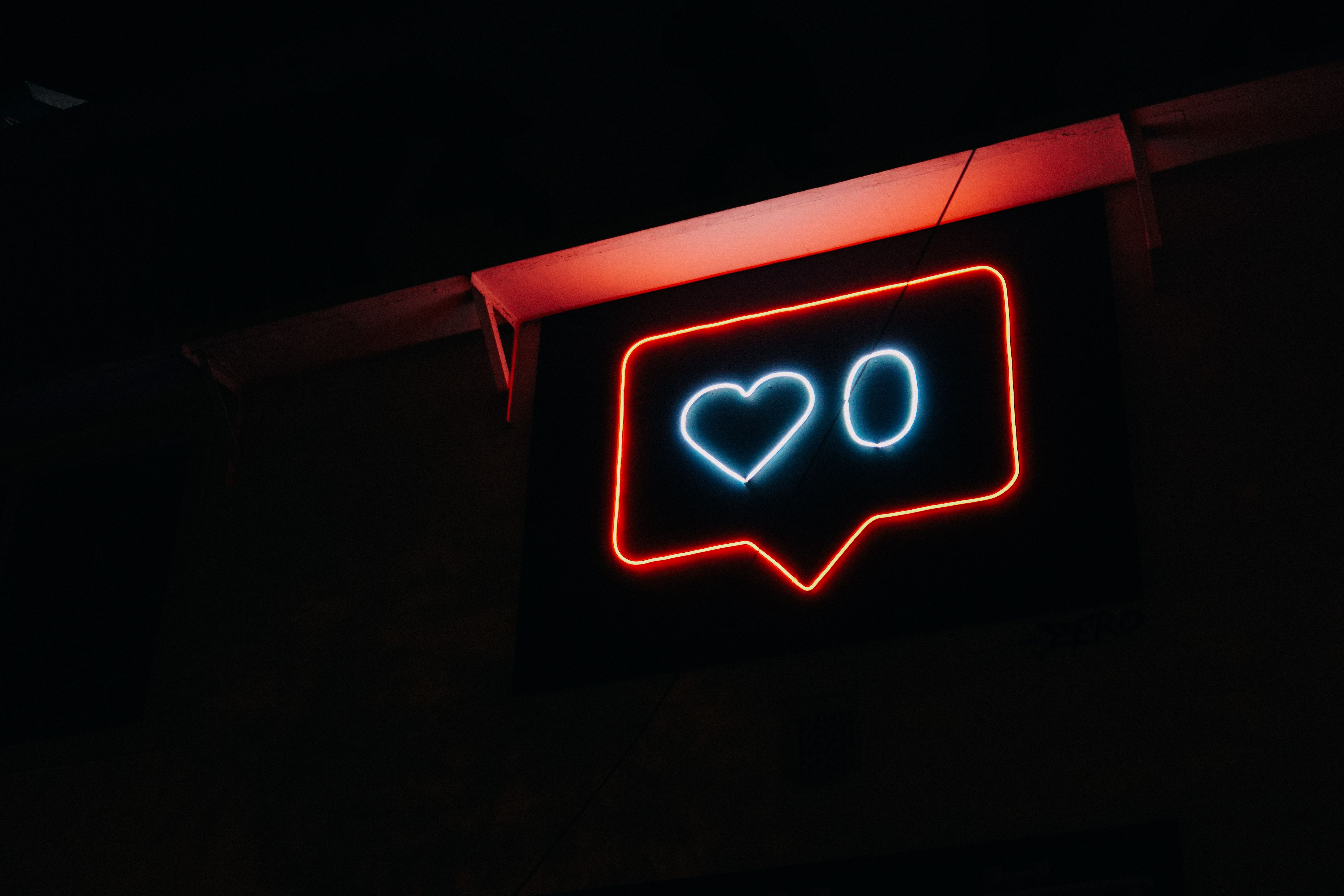 A neon sign signifying zero likes.
