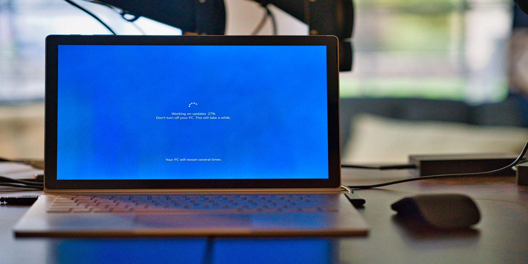 Blue Windows update screen on a laptop