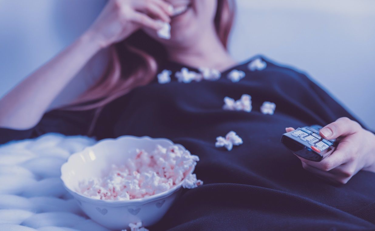 woman eating popcorn