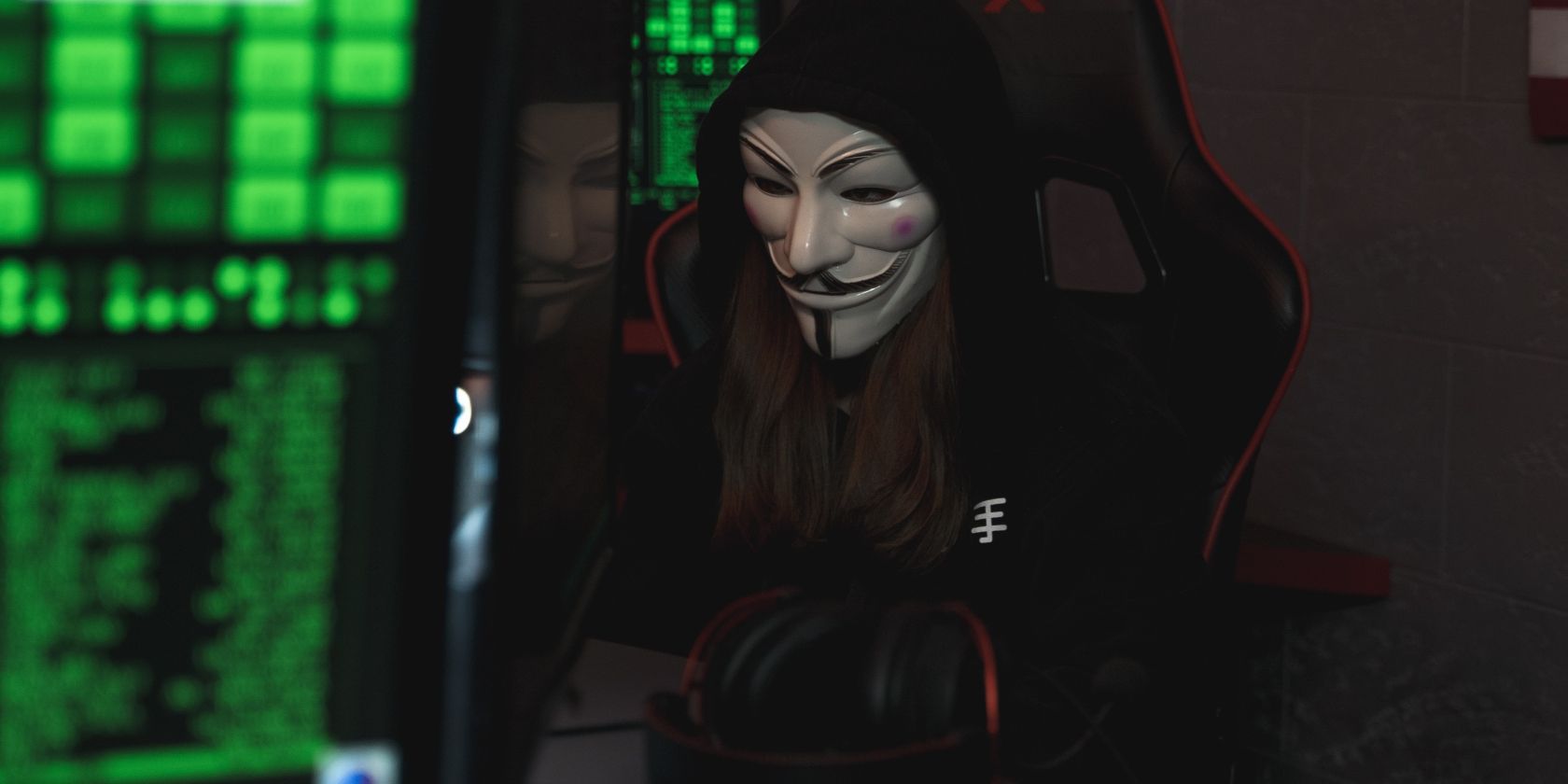 Person with Mask Sitting while Using a Computer