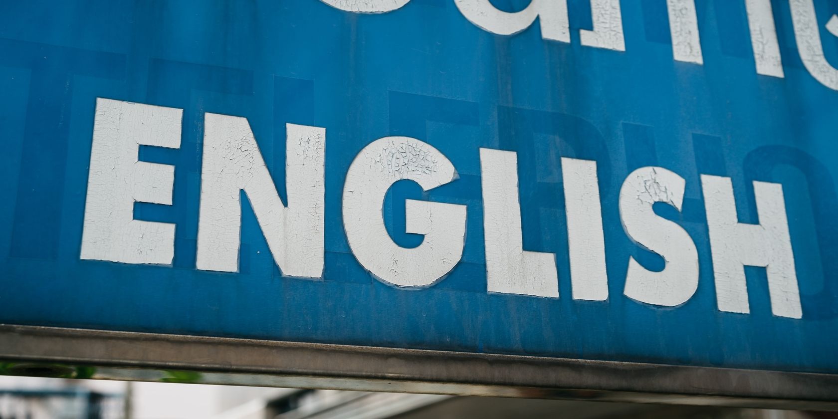 White And Blue English Sign