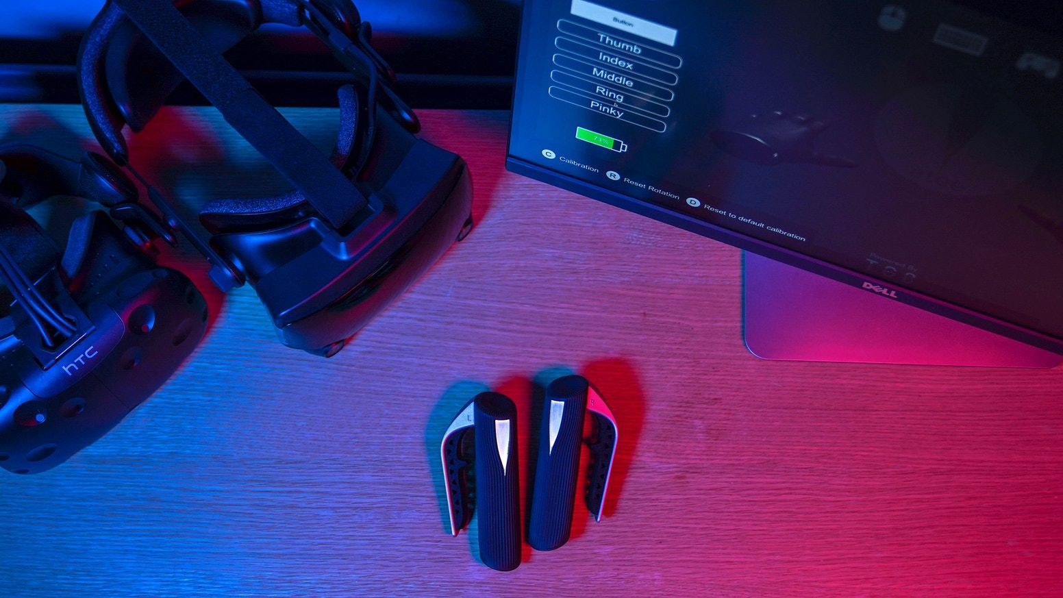etee xr black third party vr virtual reality controllers under blue and pink rgb lights