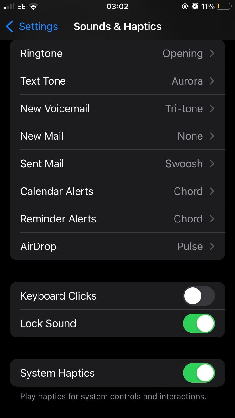 The Sounds & Haptics section of the iOS Settings app, wIth Lock Sound and System Haptics toggled On. 