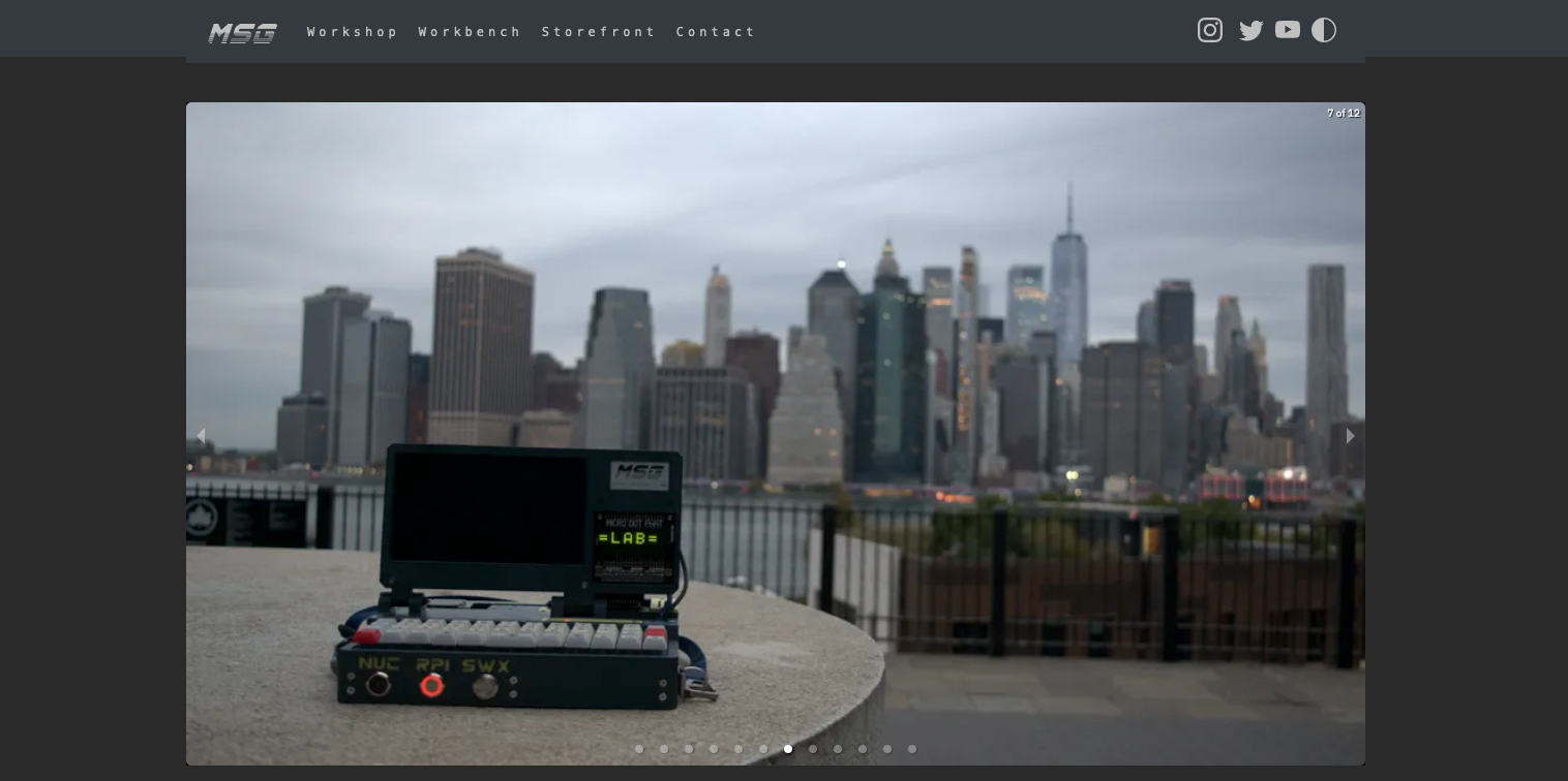 A screenshot showing an image of a DIY cyberdeck computer with a city in the background