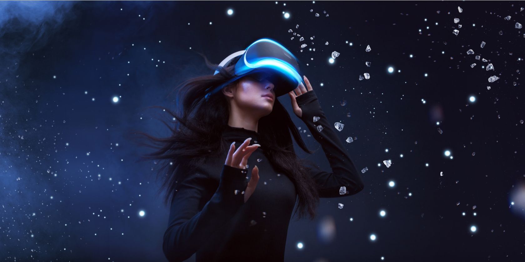 Woman wearing virtual reality headset with space background around her