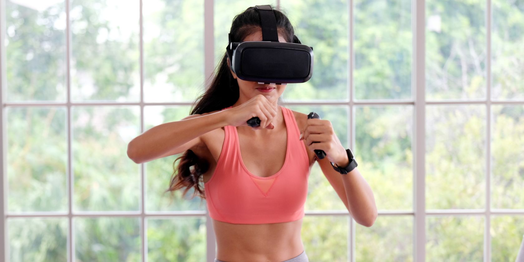 Woman using VR headset while exercising