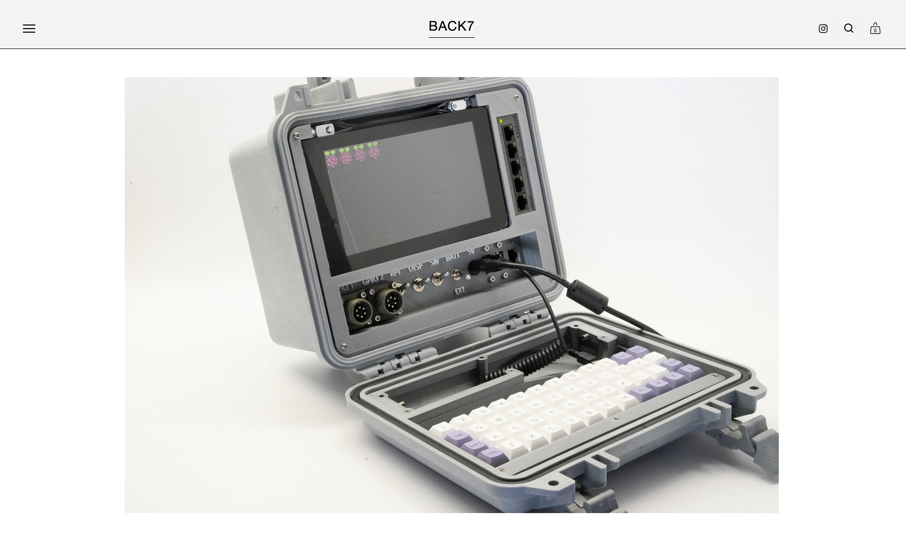 A screenshot showing a cyberdeck that has an open pelican case with a screen and keyboard inside