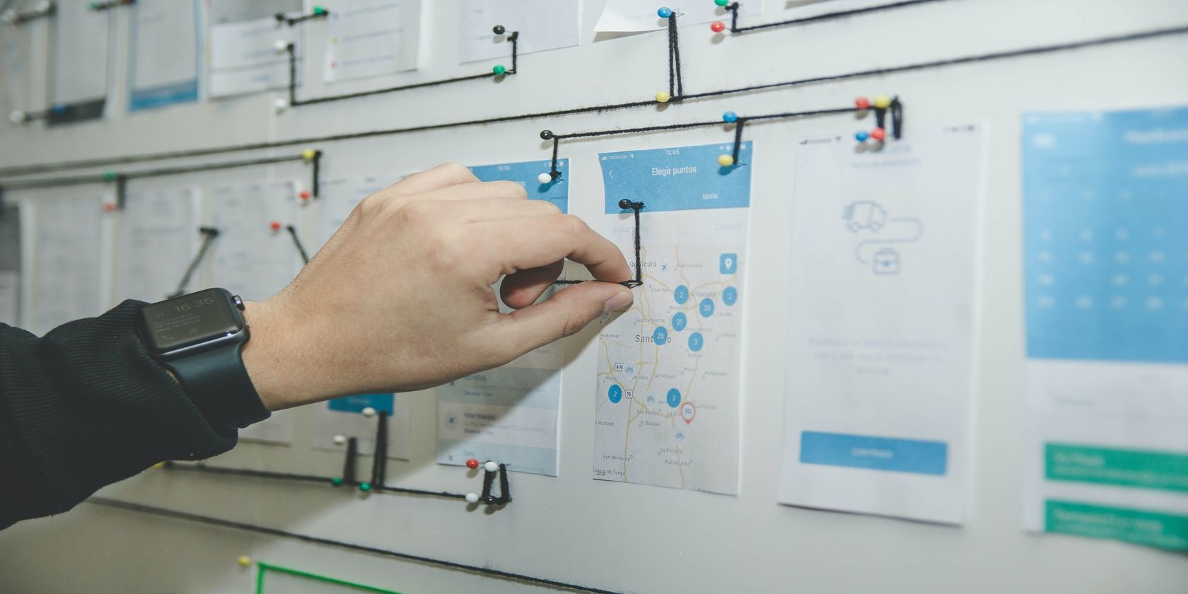 Person Placing Pins On Whiteboard, UX Planning