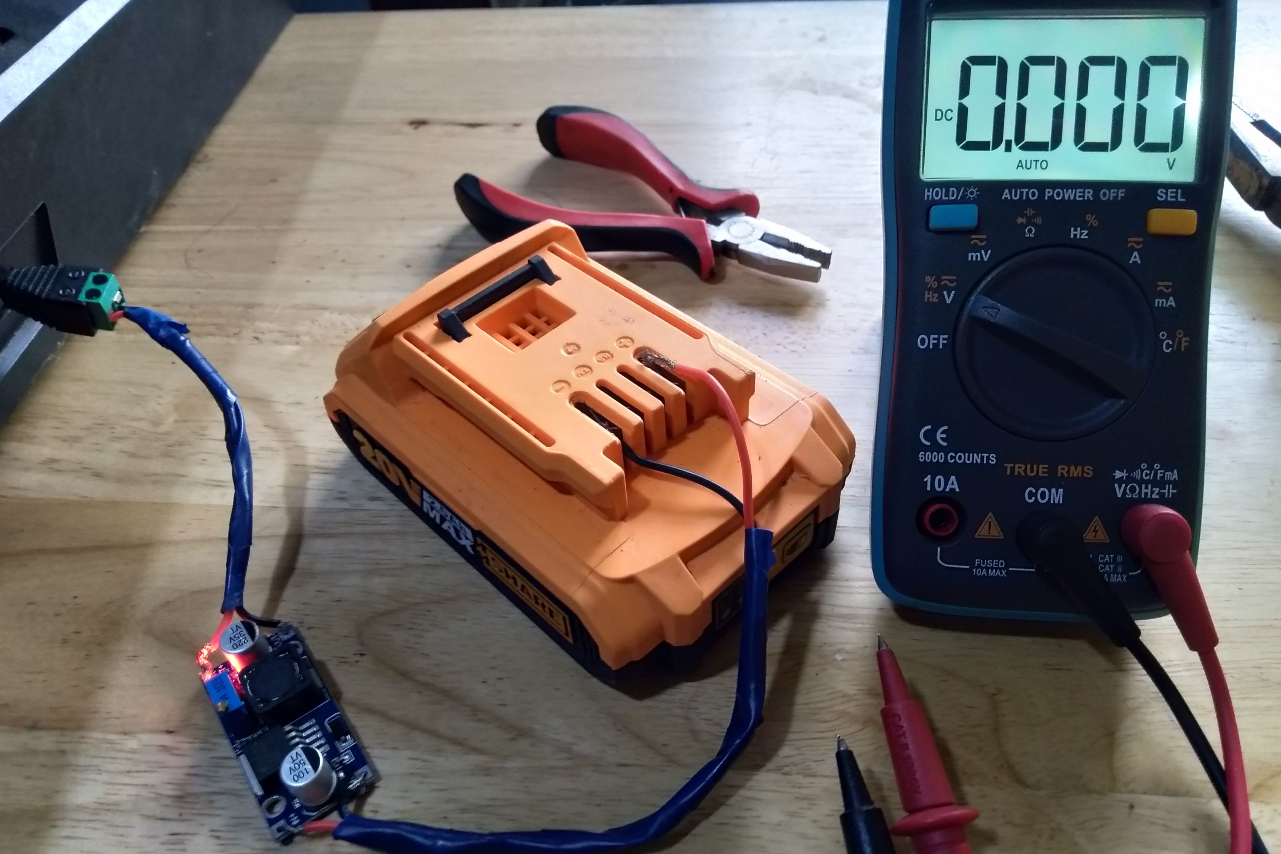 A buck converter with battery and multimeter