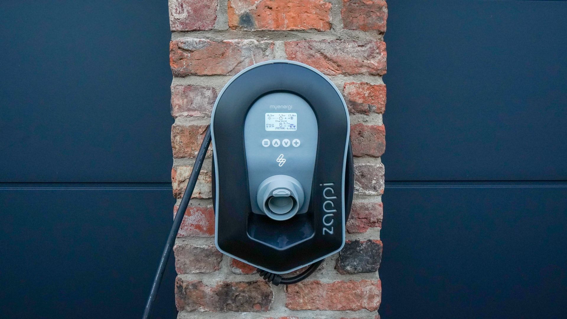 zappi solar ev home charger against brick wall