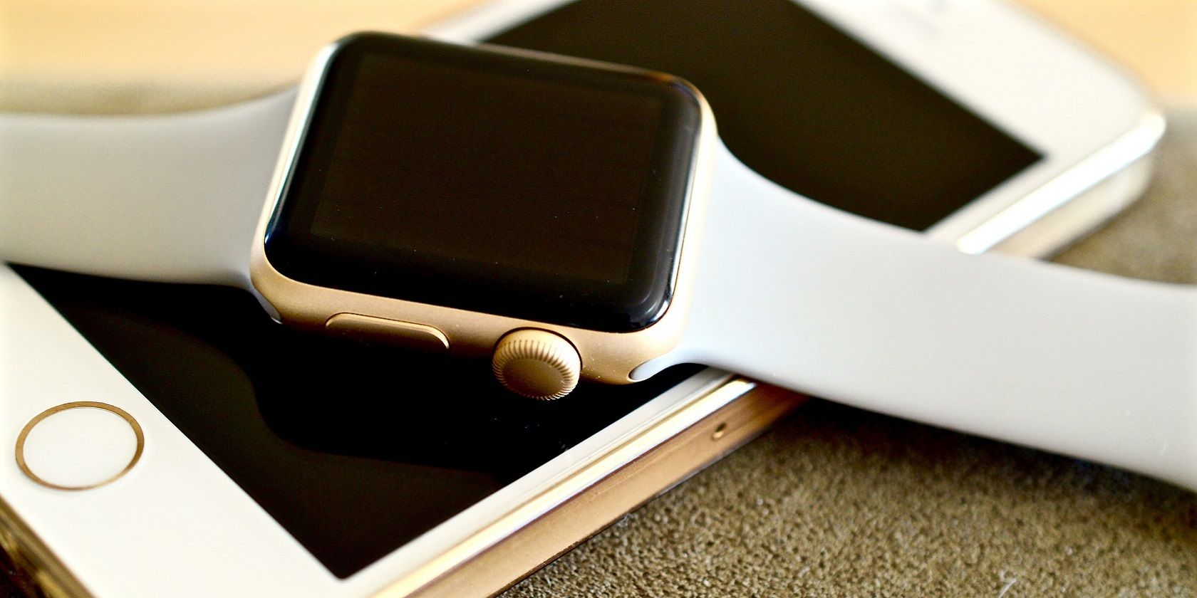 Apple Watch laying atop iPhone
