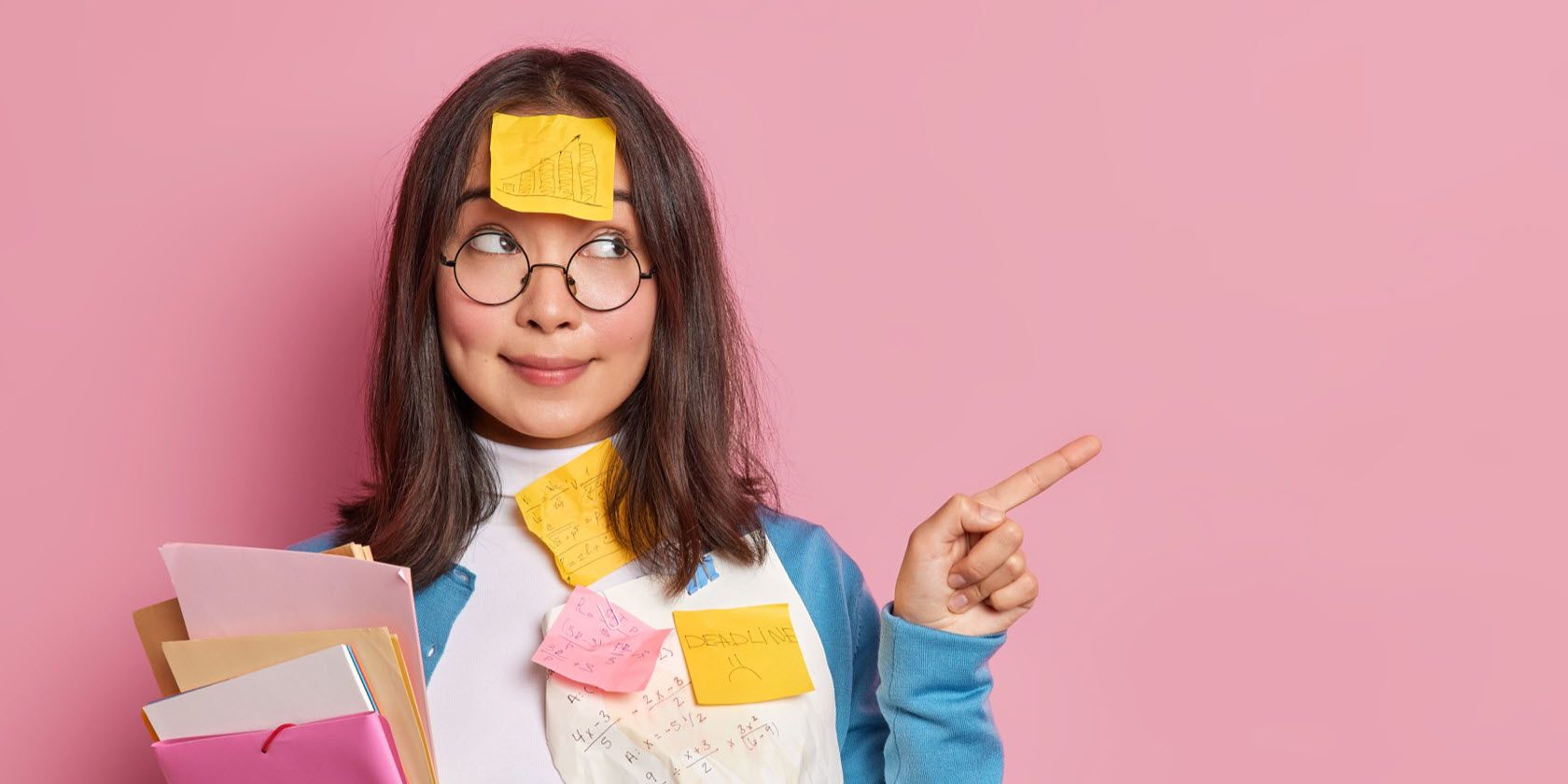 Asian girl with sticky notes pointing to the right