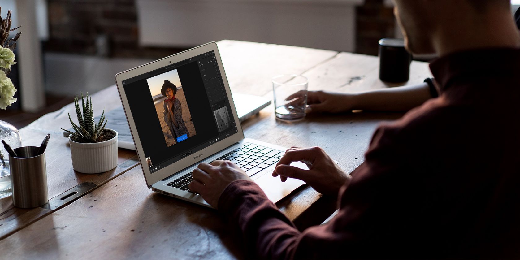 A person editing a photo in Lightroom.