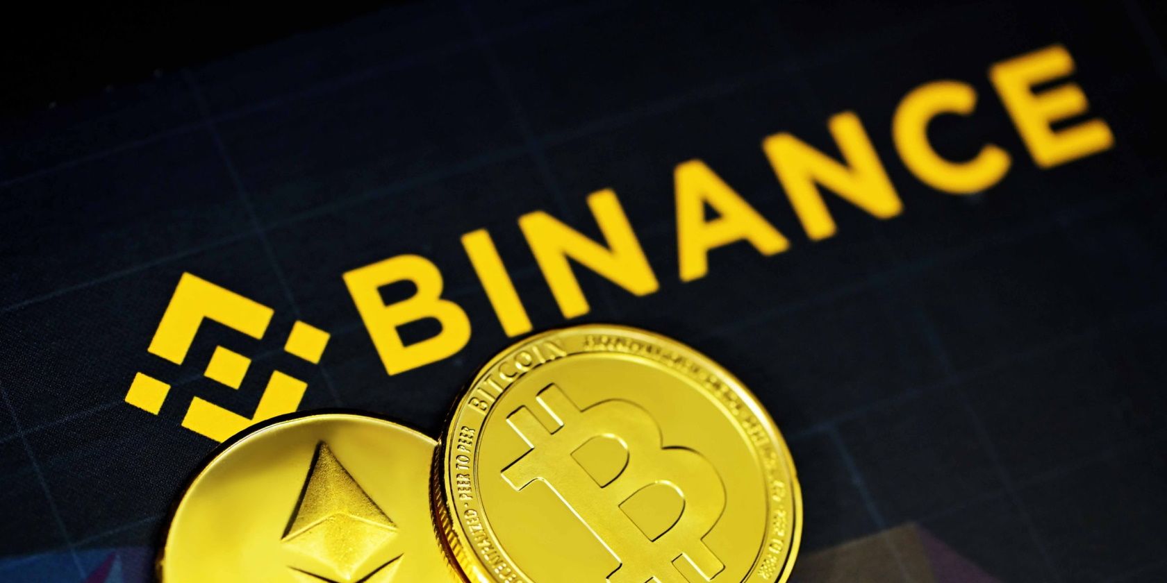 Binance logo next to Bitcoin and Ethereum