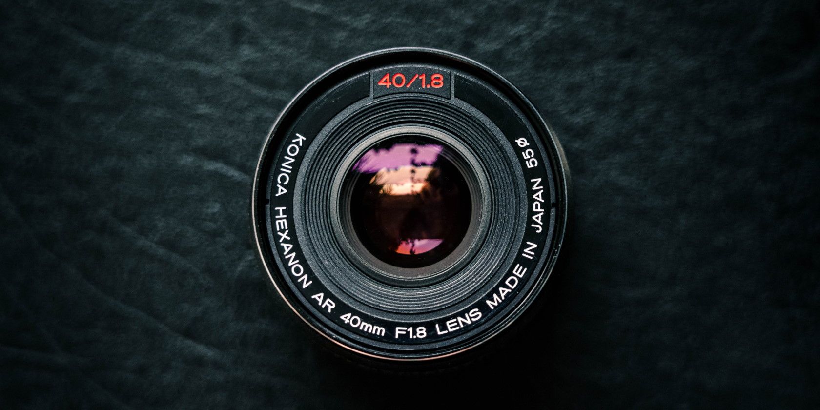 Camera lens on black surface