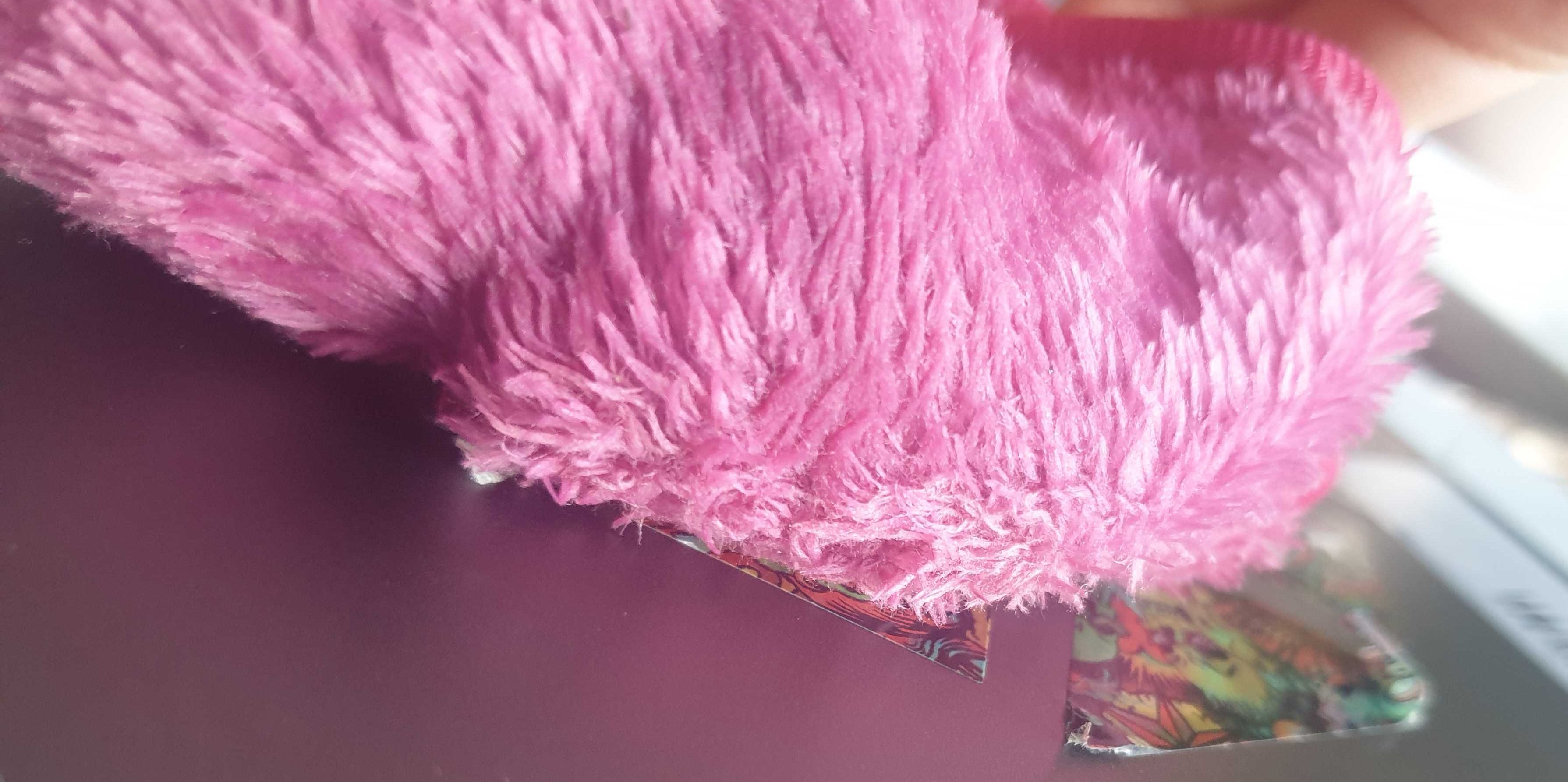 pink cloth on sticker on laptop