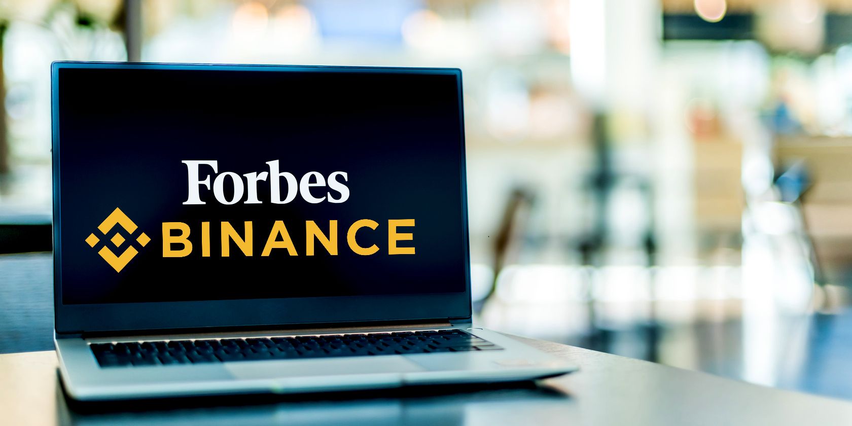 forbes binance logo on laptop feature