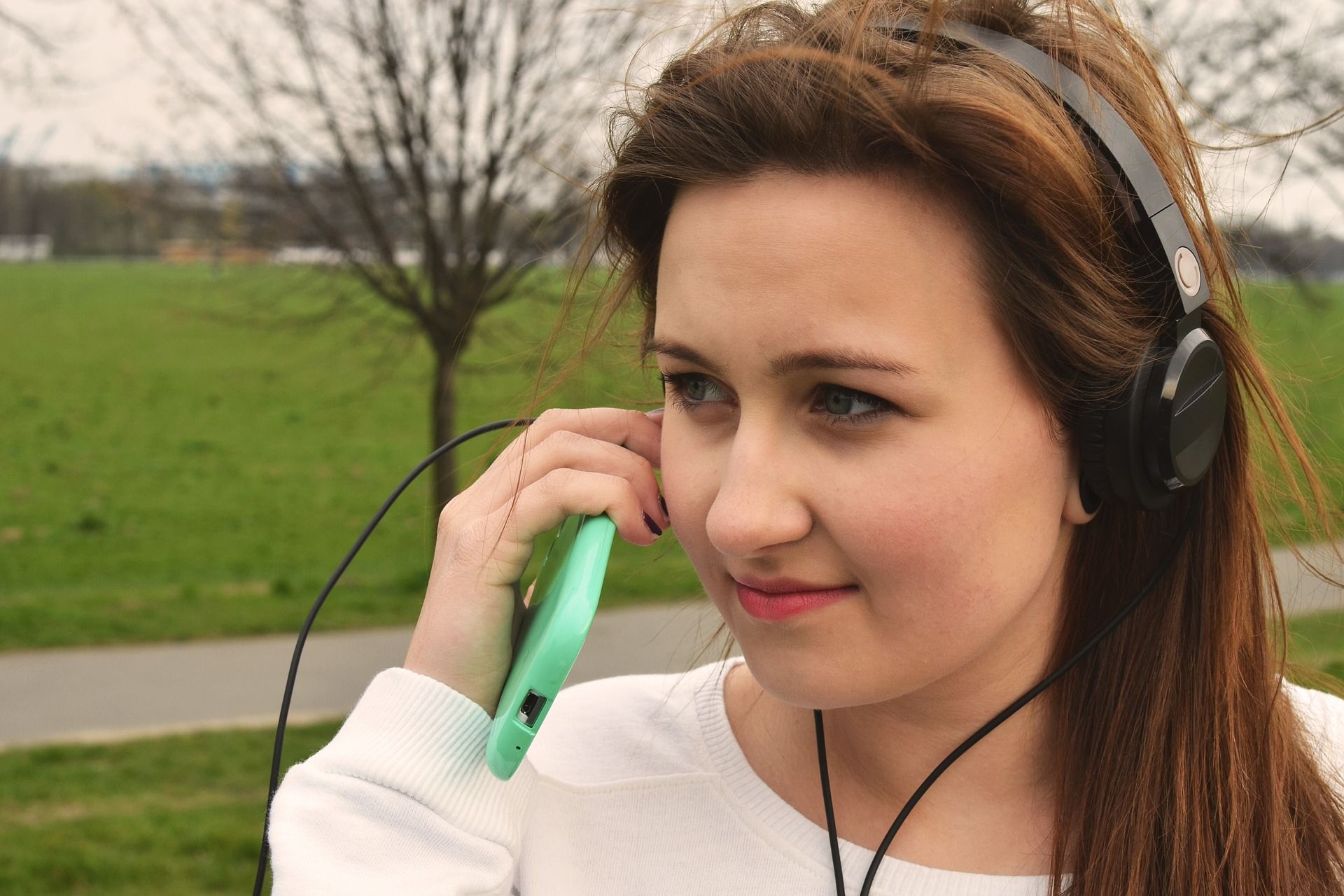 Girl Listening to Music Outside