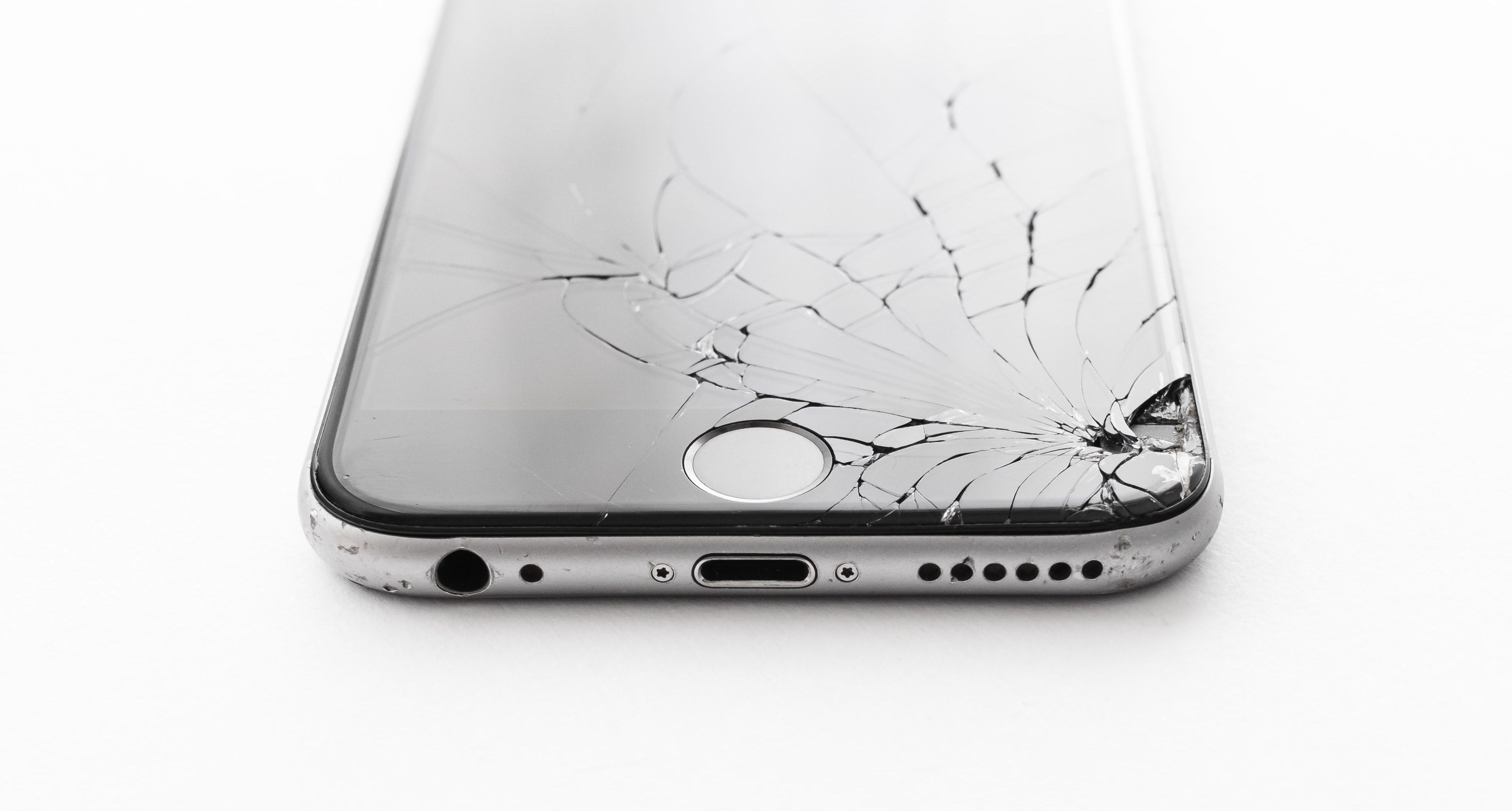 Damaged iPhone with cracks