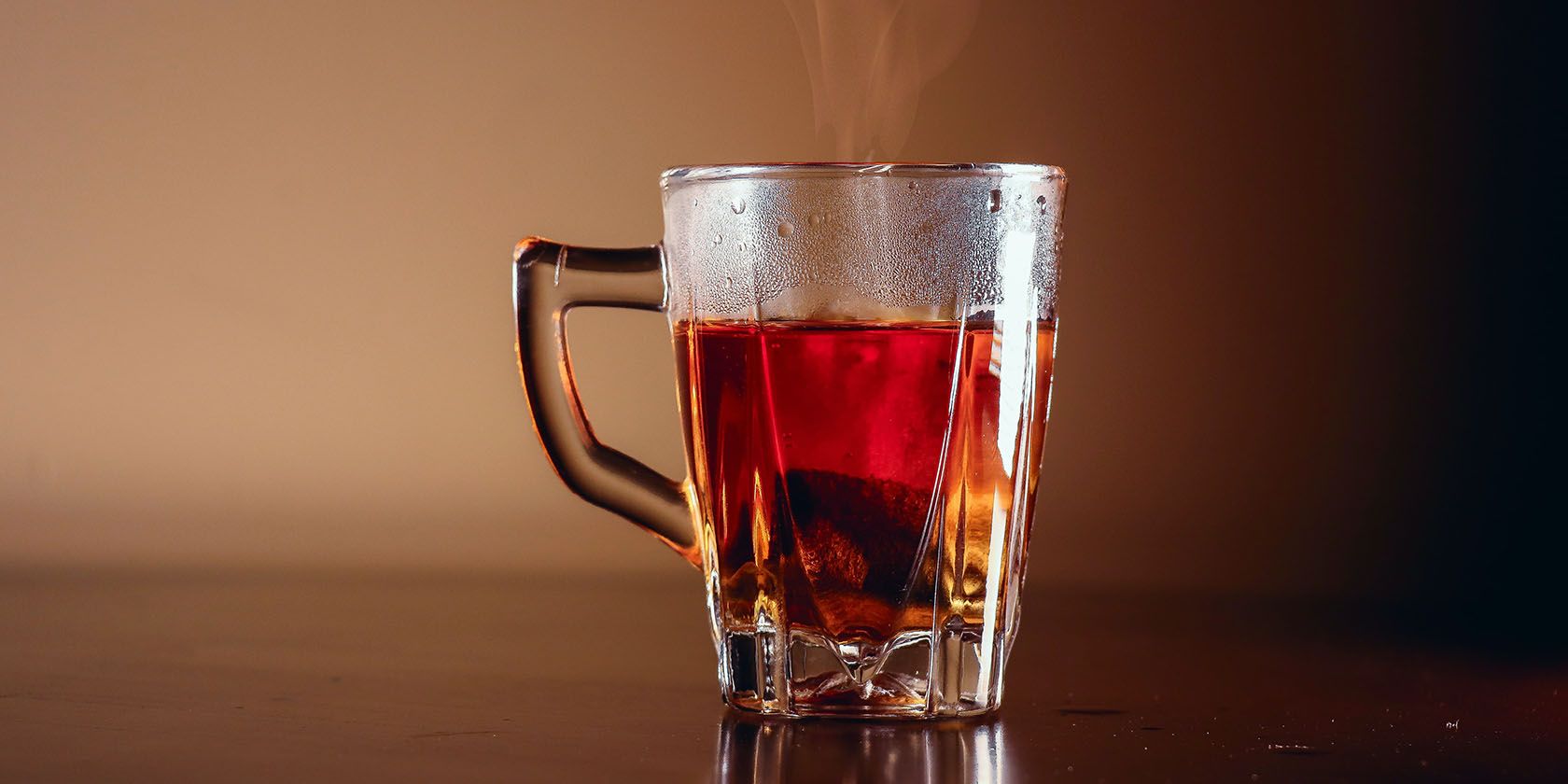 hot tea in a clear glass with steam
