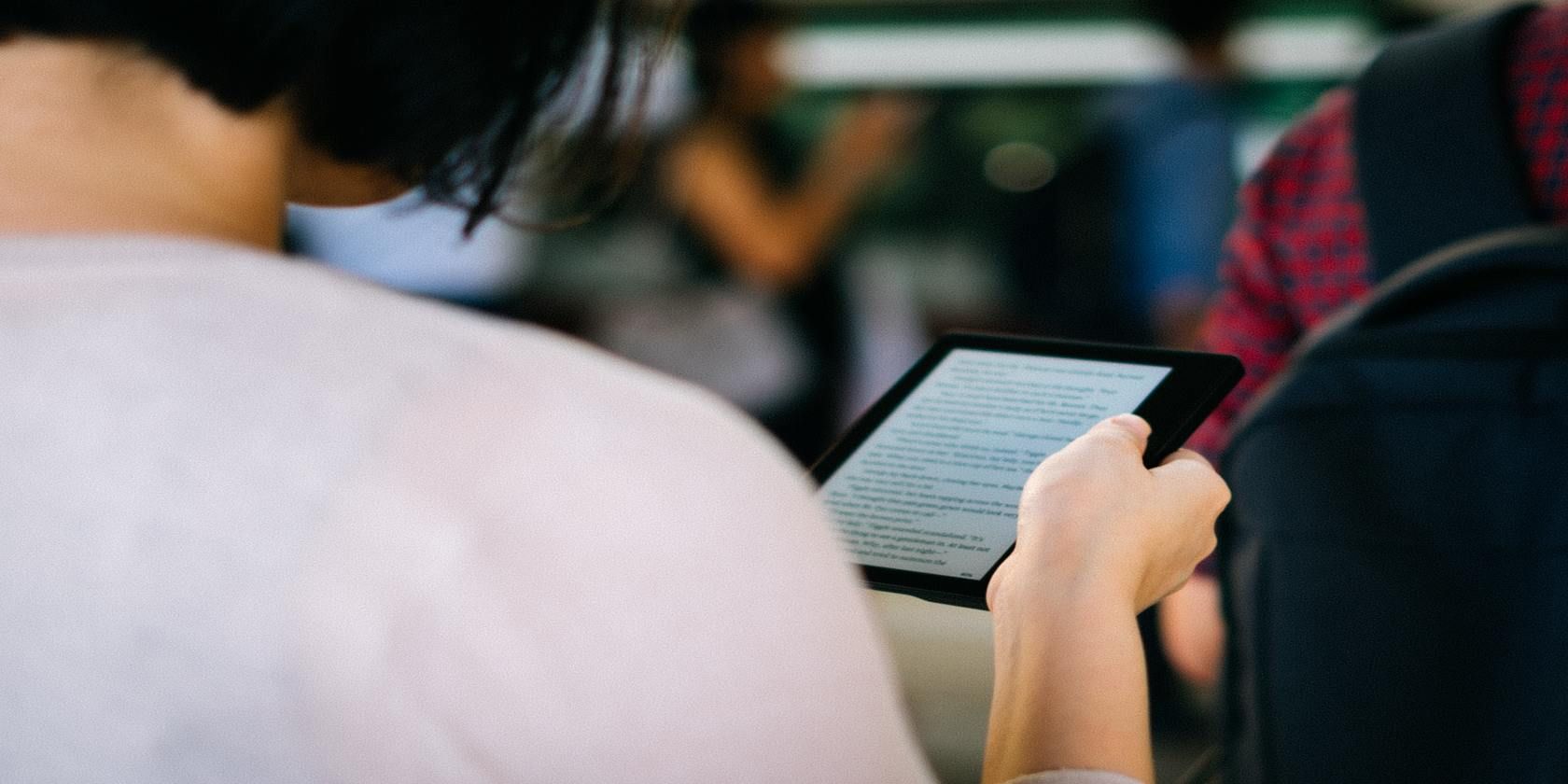 Person holding Kindle