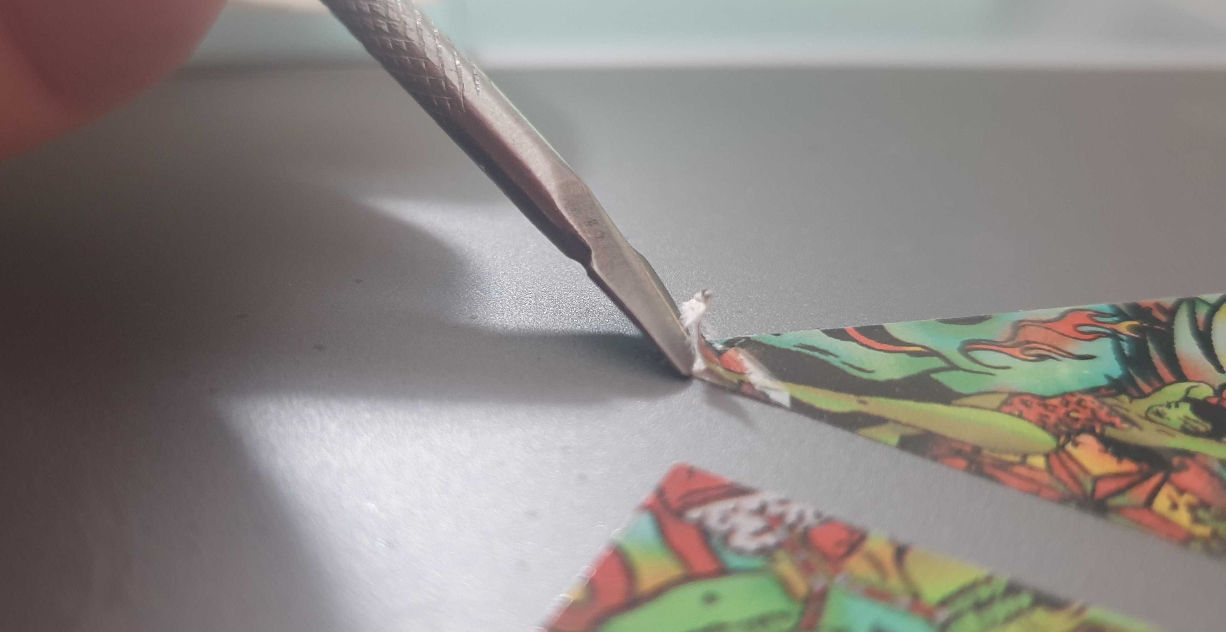 nail tool removing laptop sticker