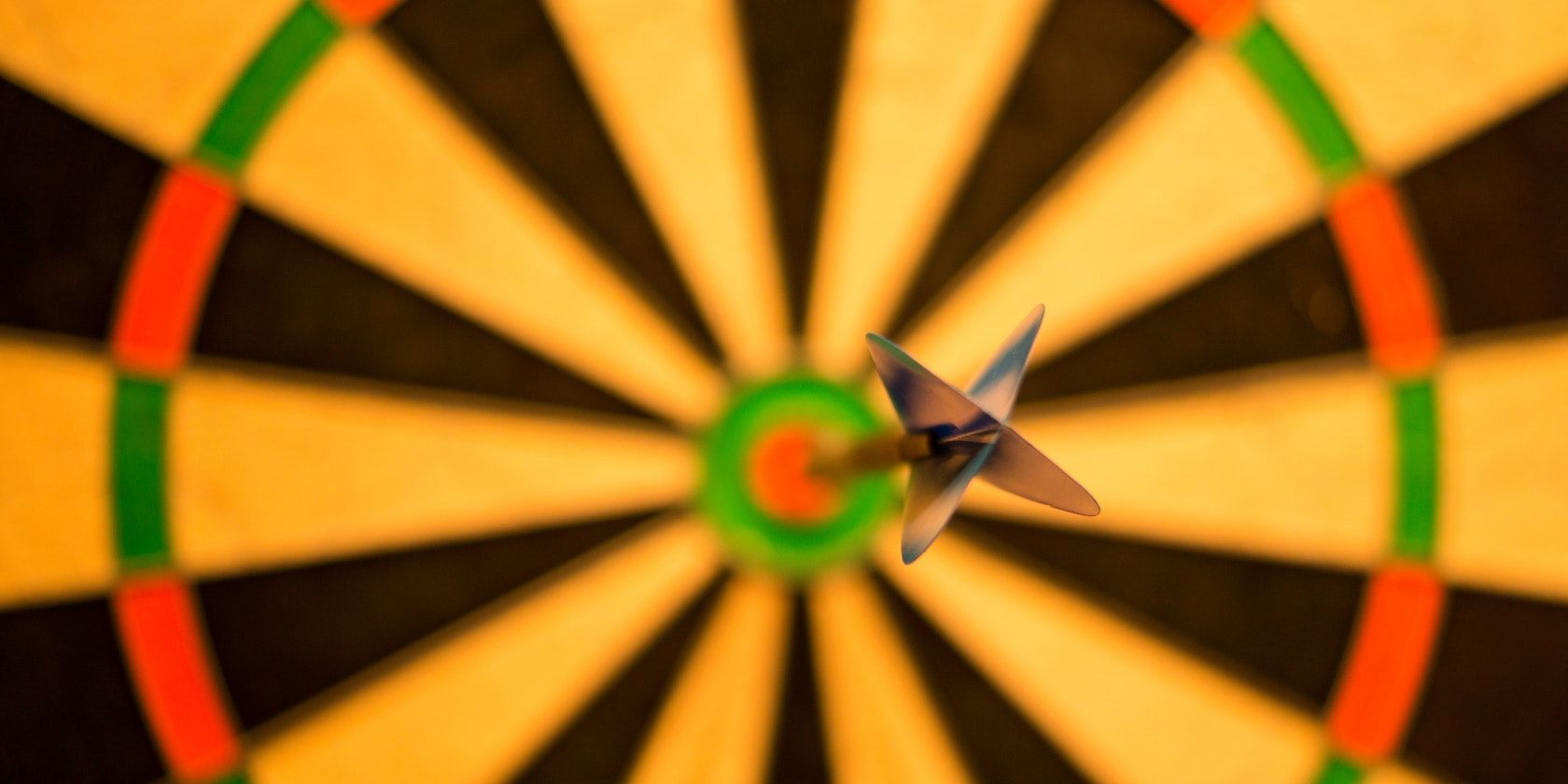 A dart in the center of a dartboard