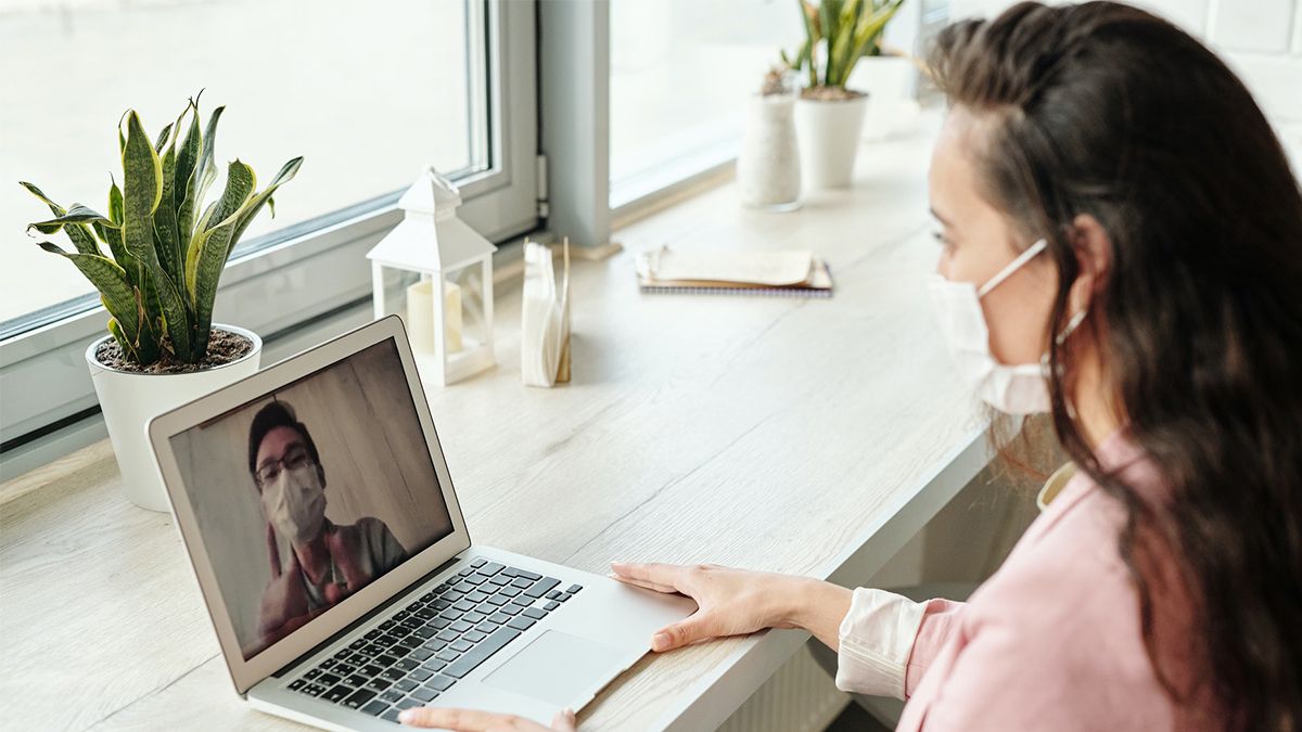 A person attending a virtual meeting