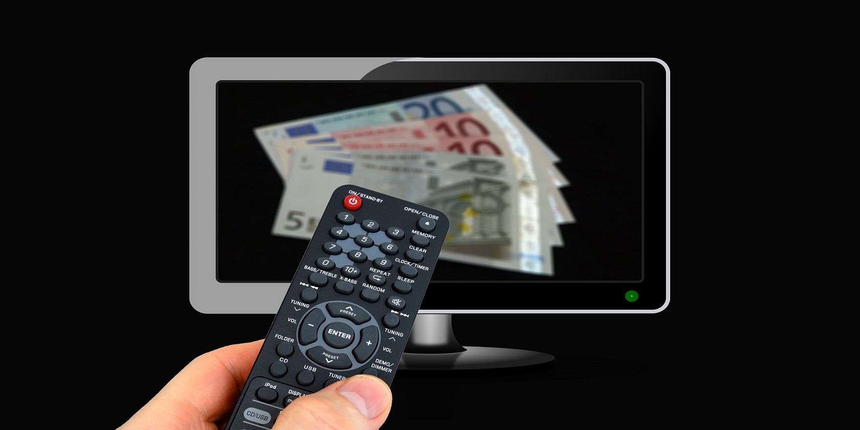 A remote control held up in front of a tv screen displaying cash in paper notes