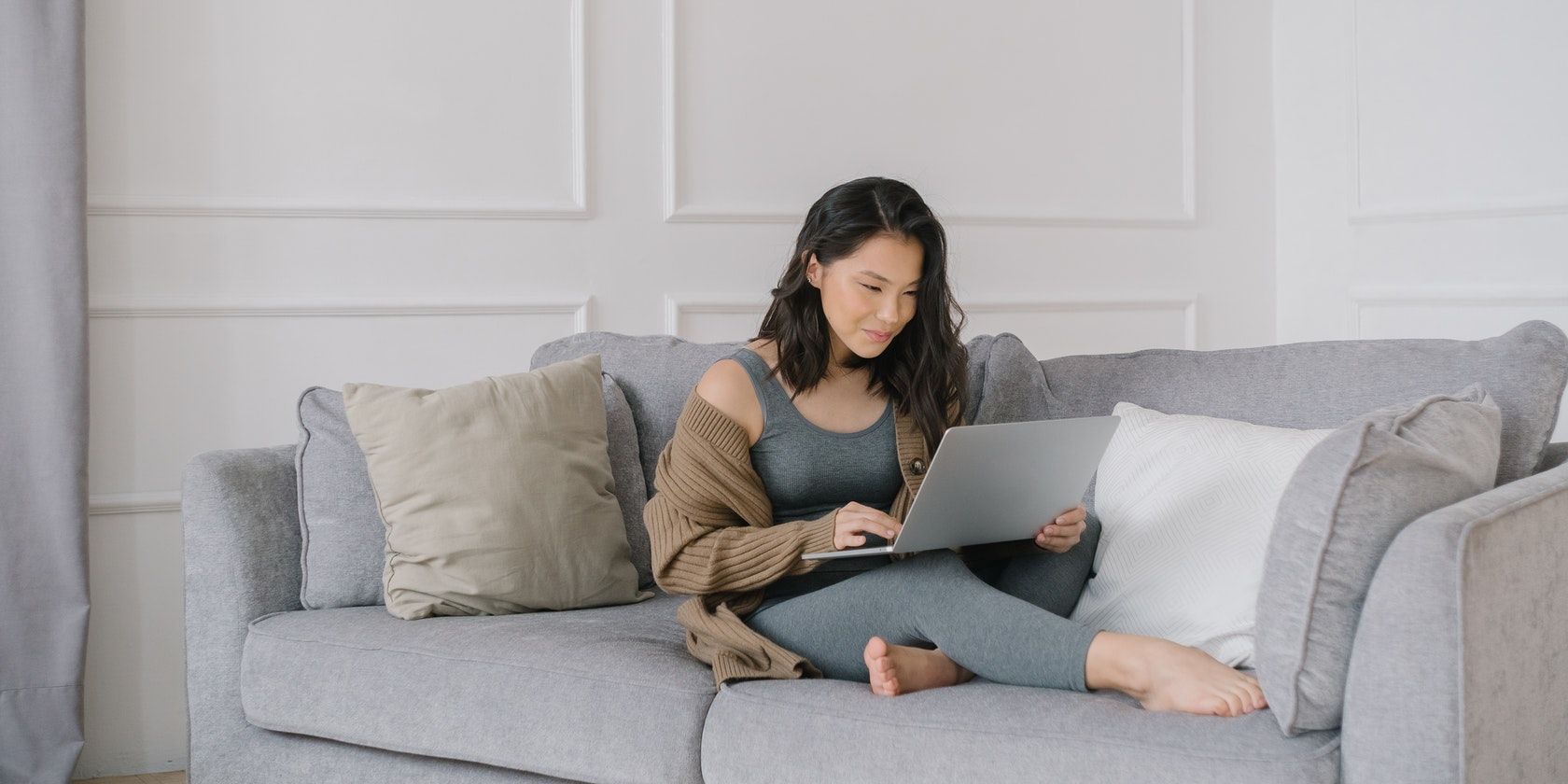 woman relaxing in front of-a laptop