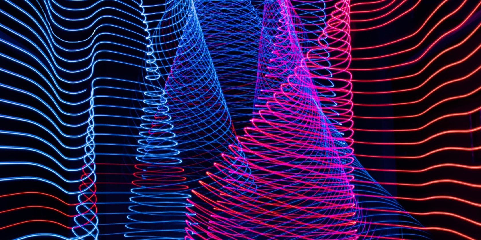 Blue and red waves on black background