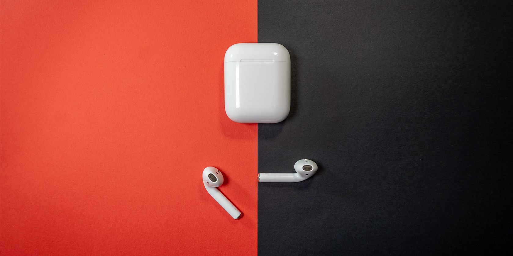 AirPods 2 on black and red table