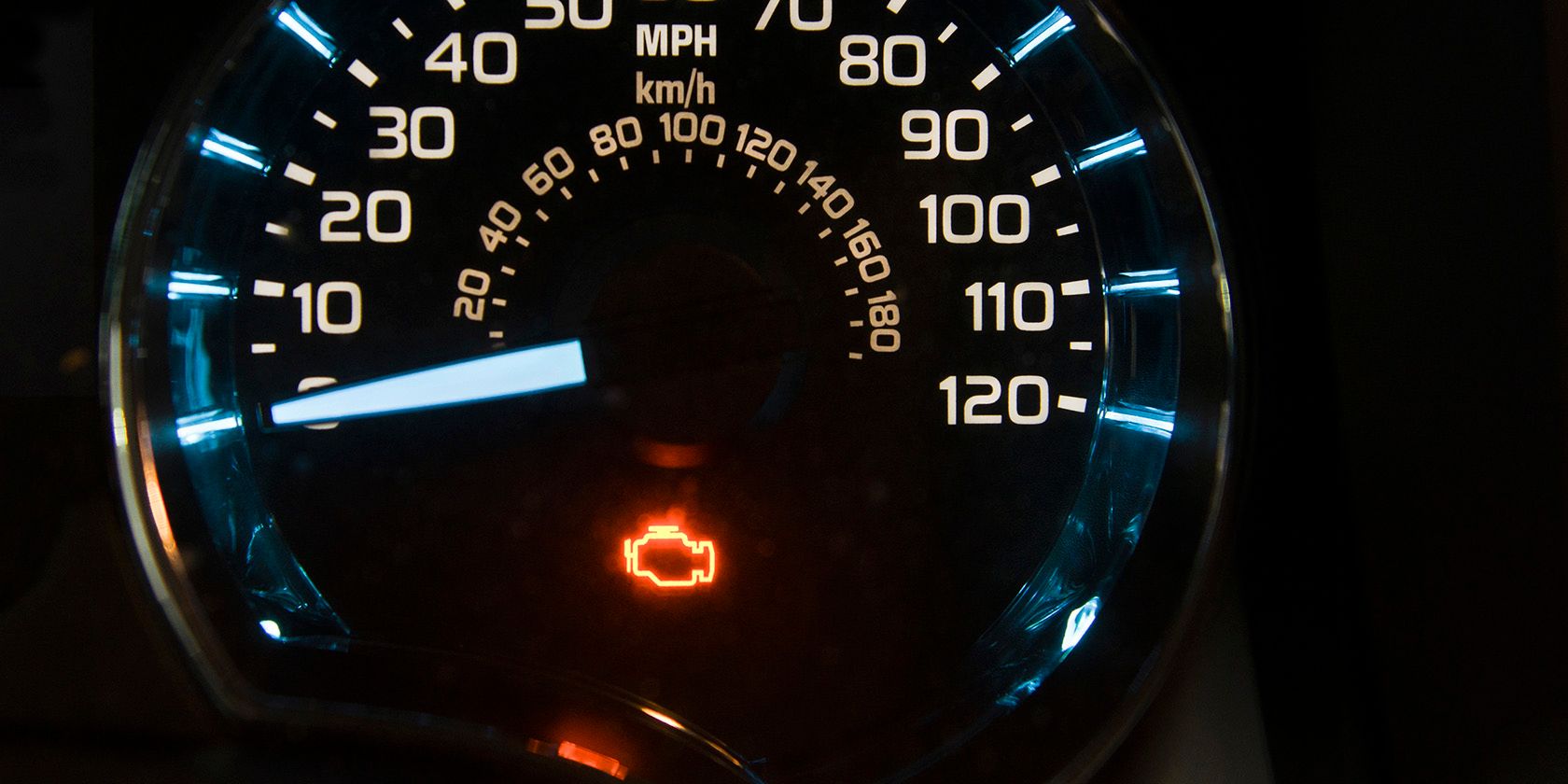 Car speedometer showing Check Engine light