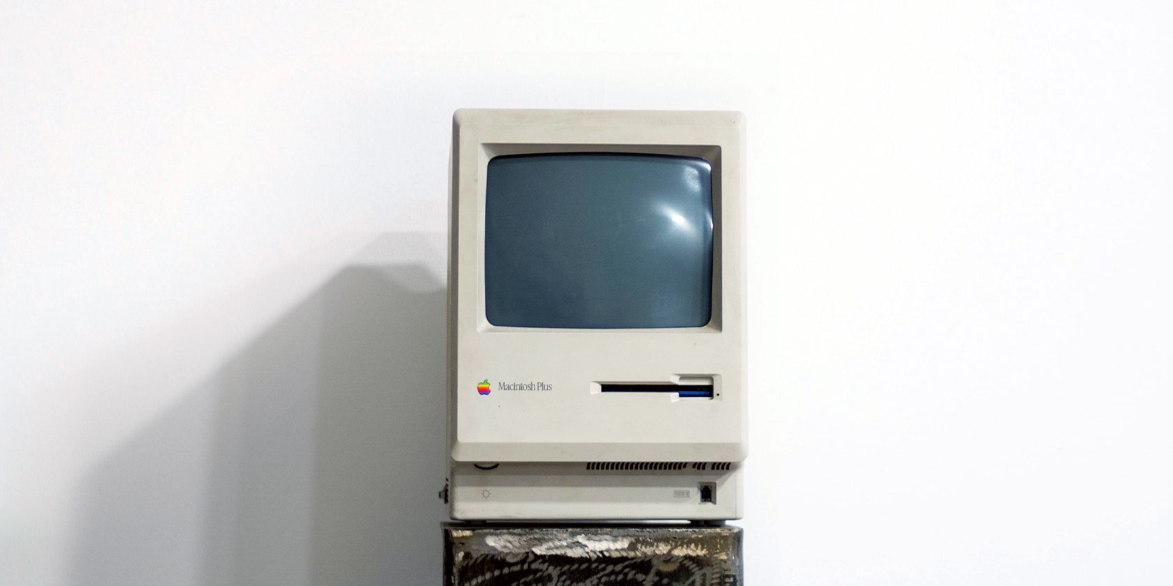 An Old Mac Computer on a Pedestal