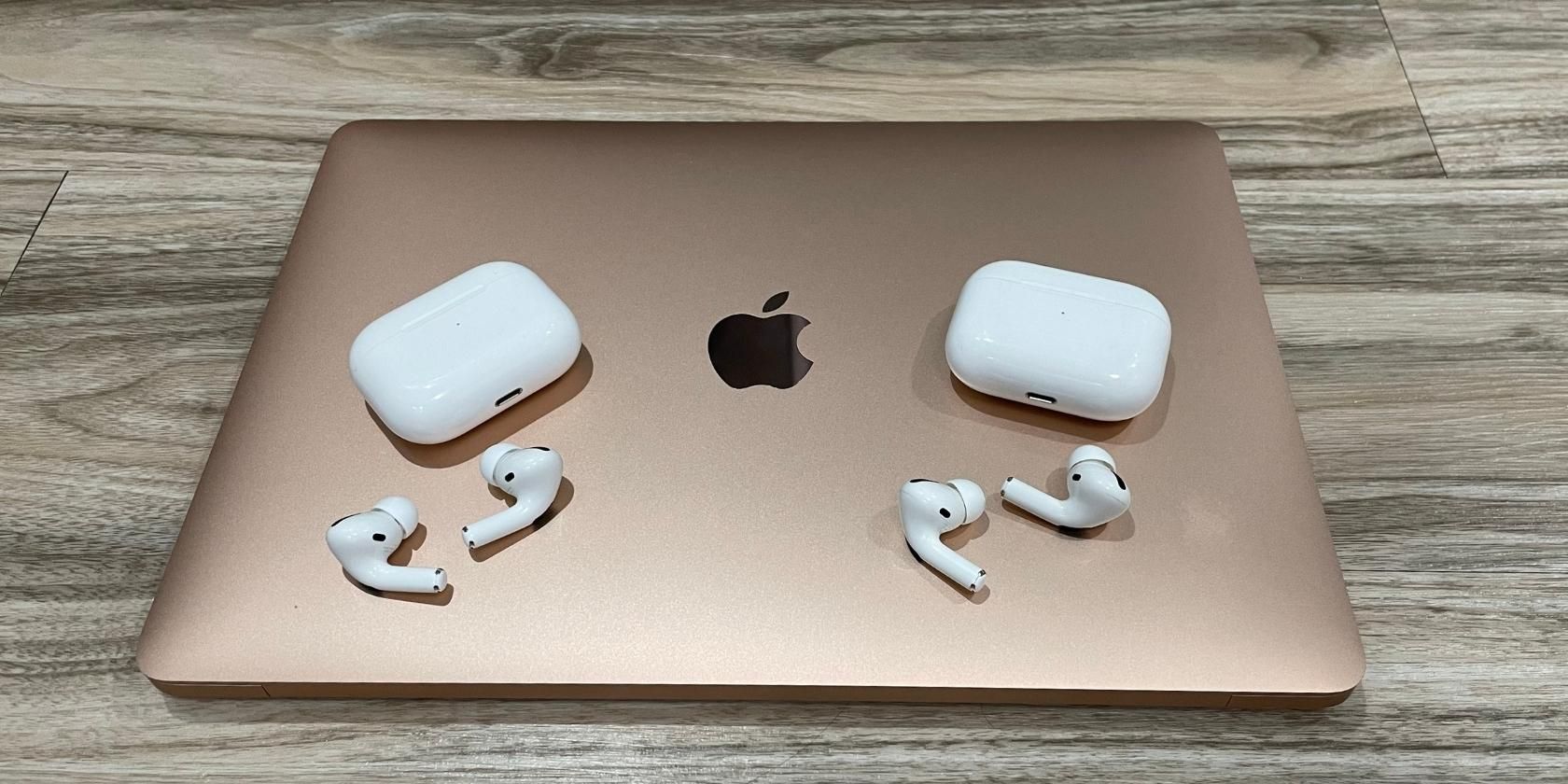 Two Sets of AirPods on Top of a MacBook