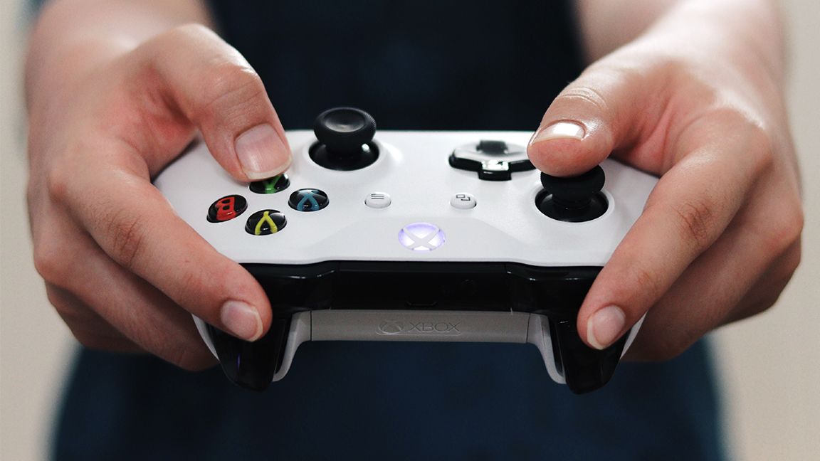 Hands holding Xbox Controller
