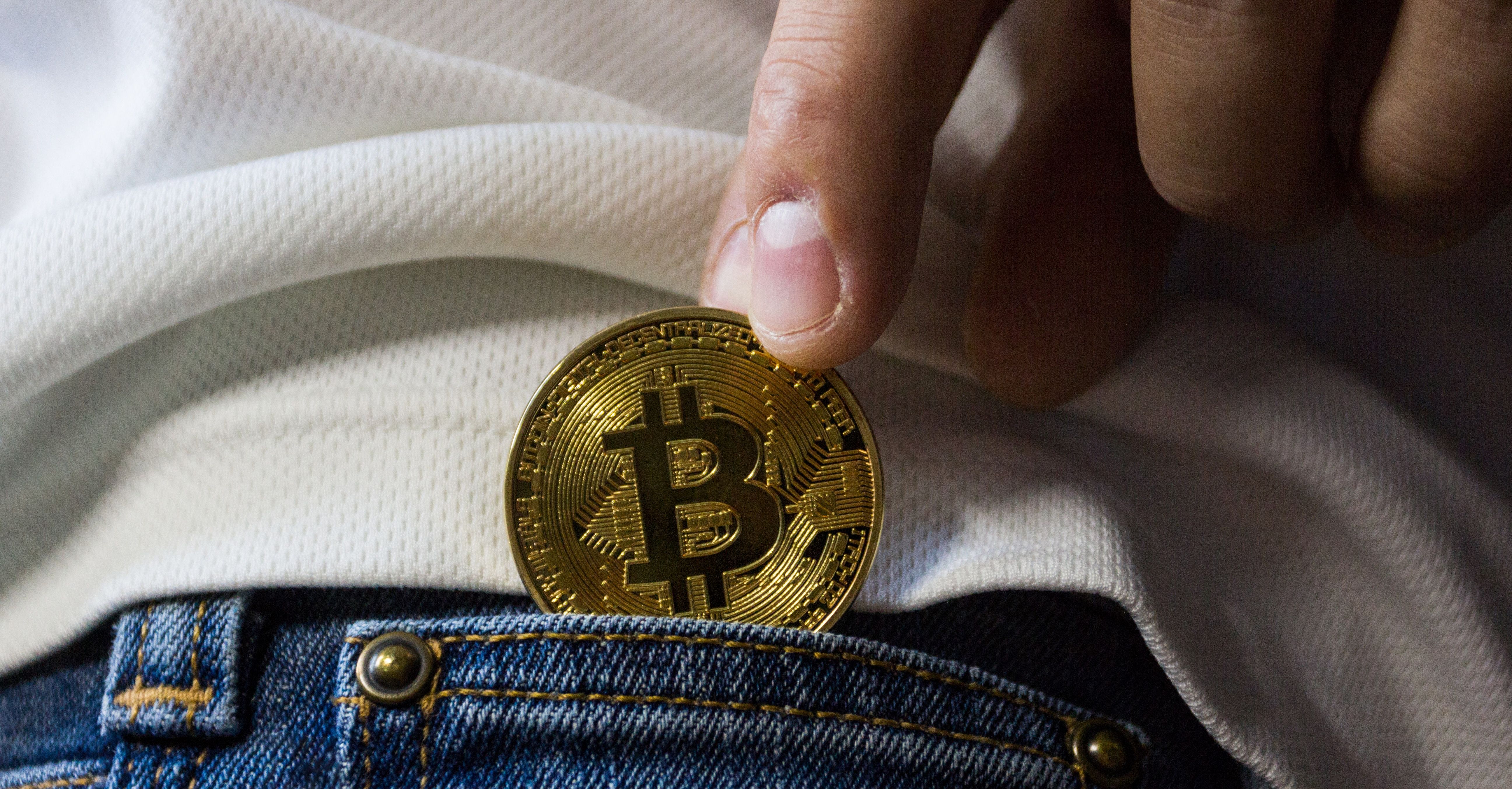 bitcoin being placed in pocket